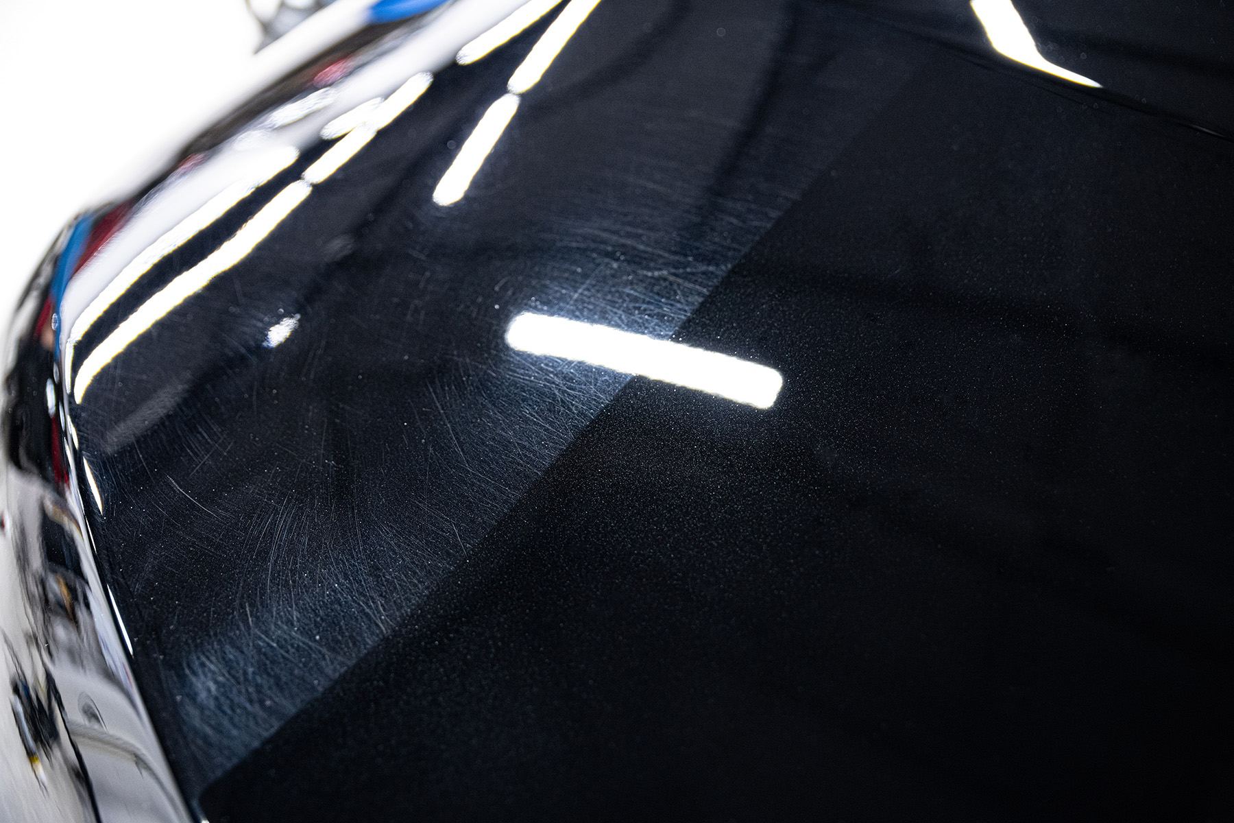 Before and after of a paint corrected hood